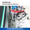 Vacuum label transfer system for carton labeling