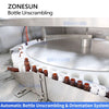 Automatic bottle unscrambling and orientation system