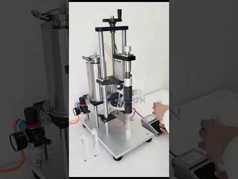 Zonesun ZS-YTZL500Q Pneumatic Vacuum Perfume Filling Machine.