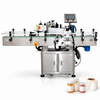 ZONESUN LT-200 Automatic Round Bottle Labeling Machine — machine with application materials on white background